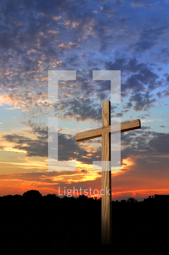 Wooden cross at sunset.