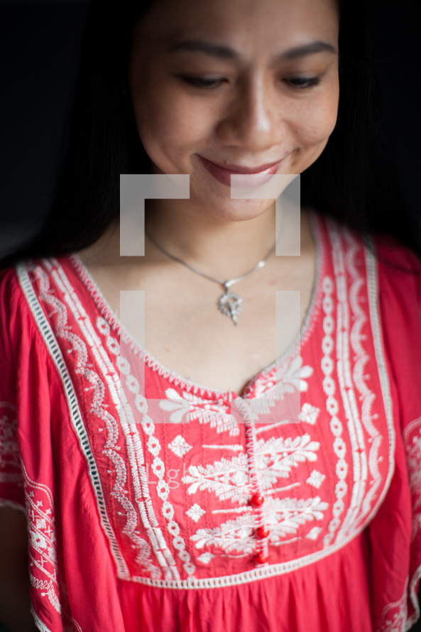 Asian woman looking down 
