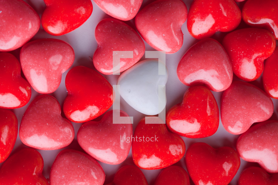 white heart candy and red heart shaped candy