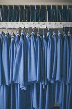 Choir robes hanging in a closet.