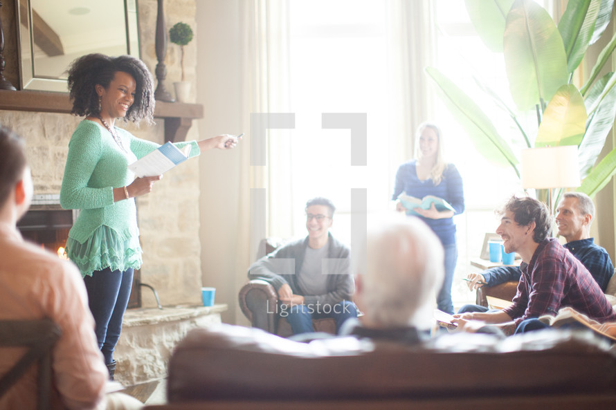 a woman leading a discussion at a Bible study 