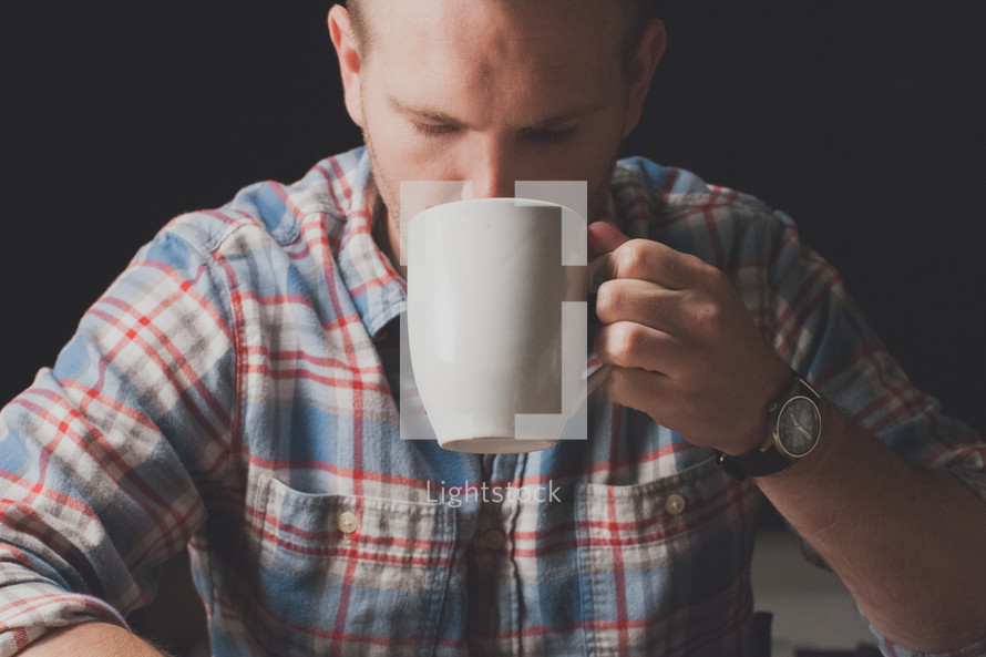 A man drinking coffee.