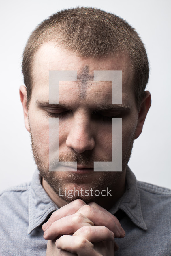 A man with ashes on his forehead for Ash Wednesday
