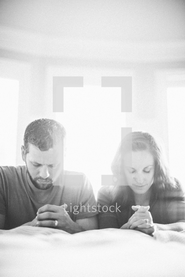 husband and wife in prayer