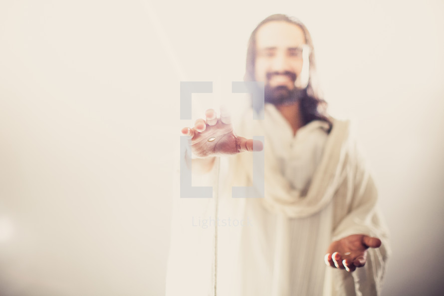 The resurrected Christ -- Jesus extending his hands with an invitation to follow Him.
