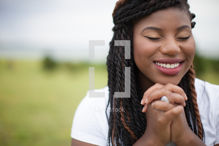 joyful woman in prayer 