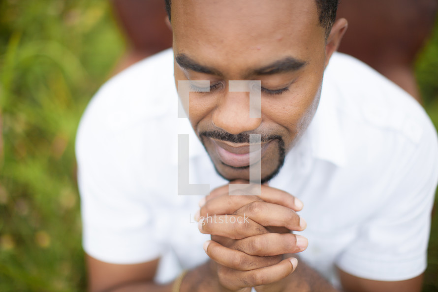 man in reverent prayer 