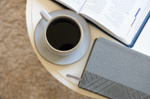 coffee table with Bible, coffee cup, and journal 