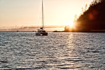 catamaran sailing at sunset 