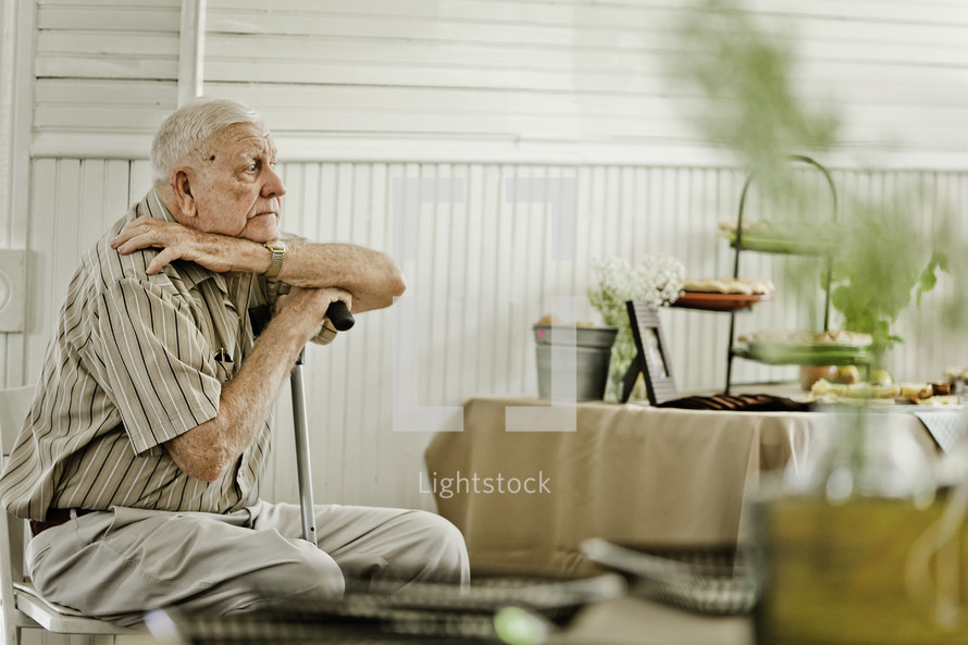 Elderly man sitting in chair