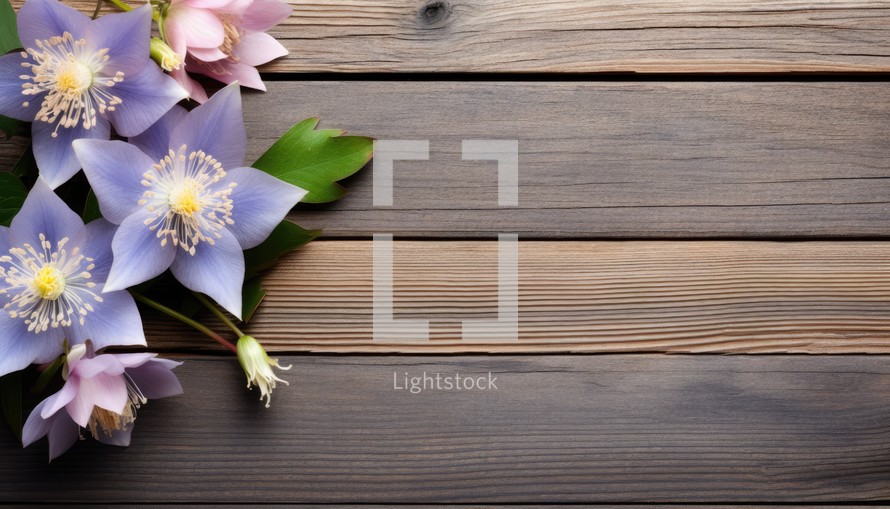 Bouquet of flowers on wooden background. Top view with copy space