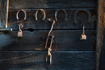 Horse shoes on a barn wall