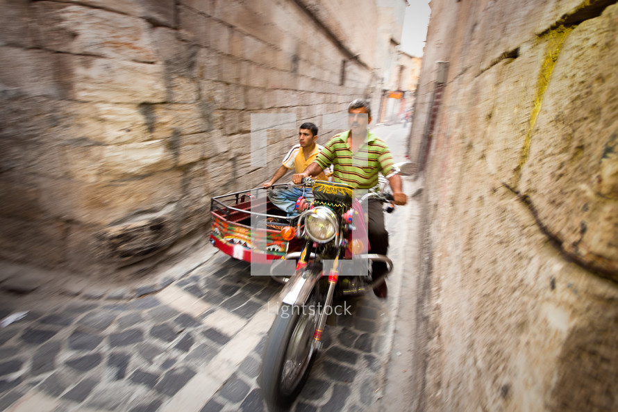 Motorcycle on the narrow streets of old Ottoman district in Shanli Urfa