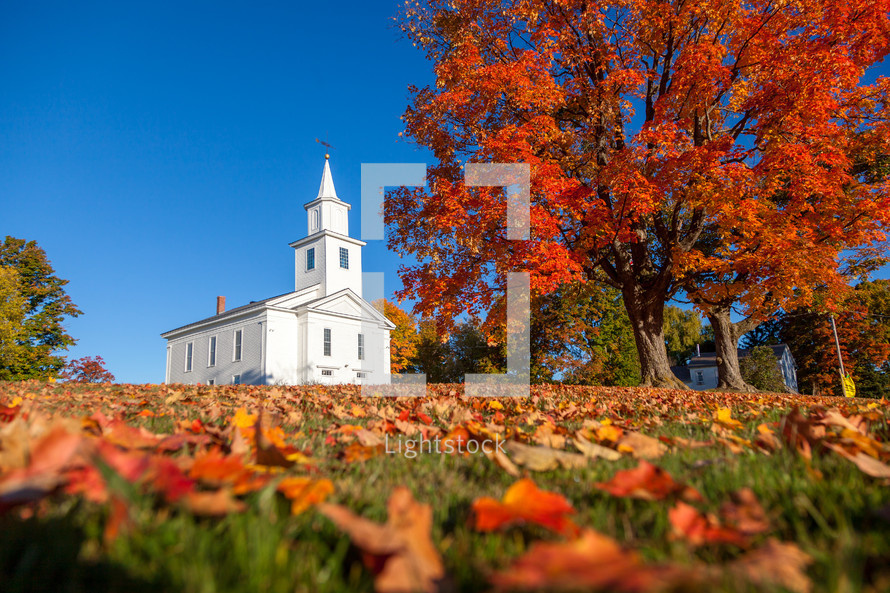 rural church surrounded by fall leaves 