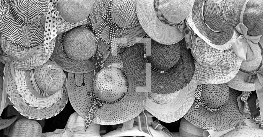 straw hats in a market 