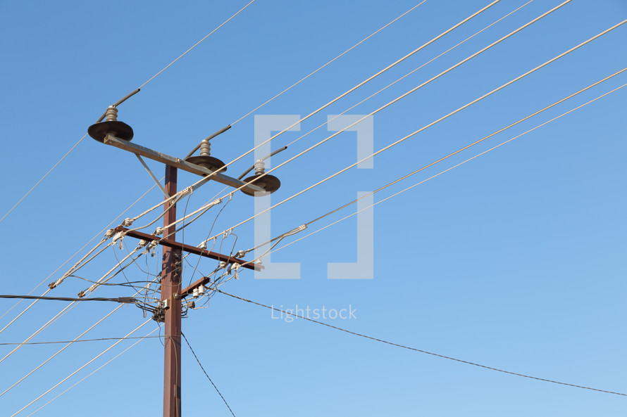 power lines in a blue sky 