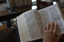A woman reading the Bible at a home group study