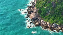 Aerial top view. Sea waves breaking over rocks.Tropical sea wave. 