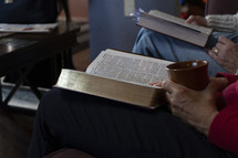 Close up of women studying the Bible at a home group meeting