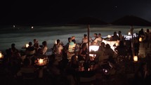 People relaxing in outdoor sea shore cafe 