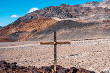 cross in a desert landscape 
