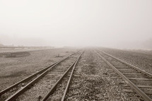 fog over train tracks 