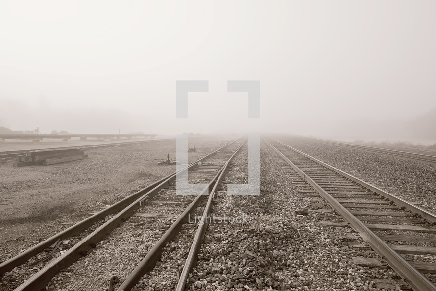 fog over train tracks 