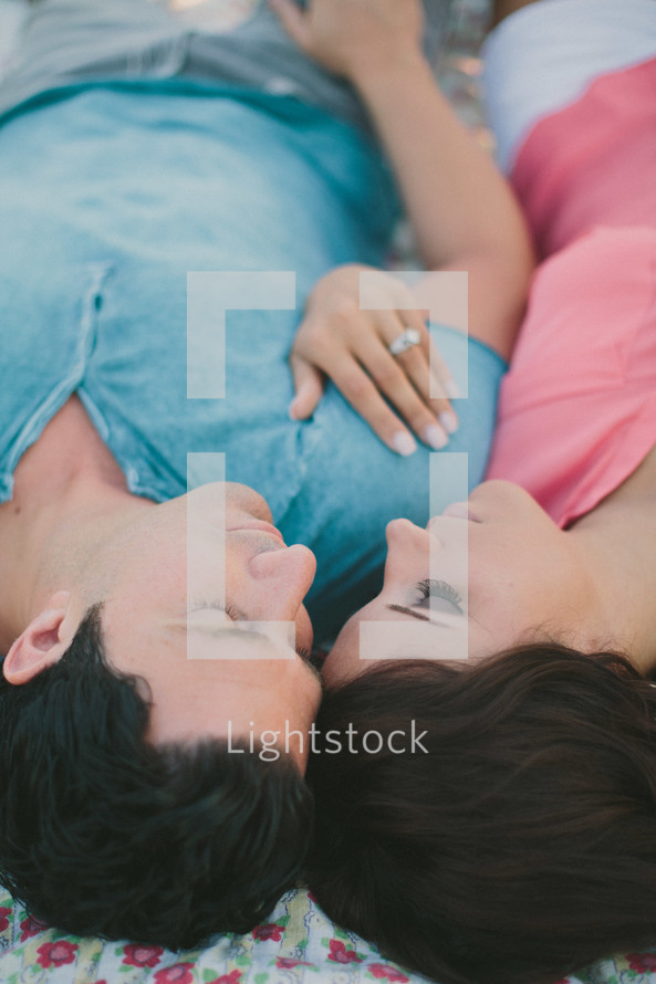 Couple cuddling outdoors