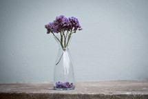 purple flowers in a clear vase 