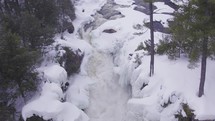 Aerial drone shot of a frozen waterfall 
