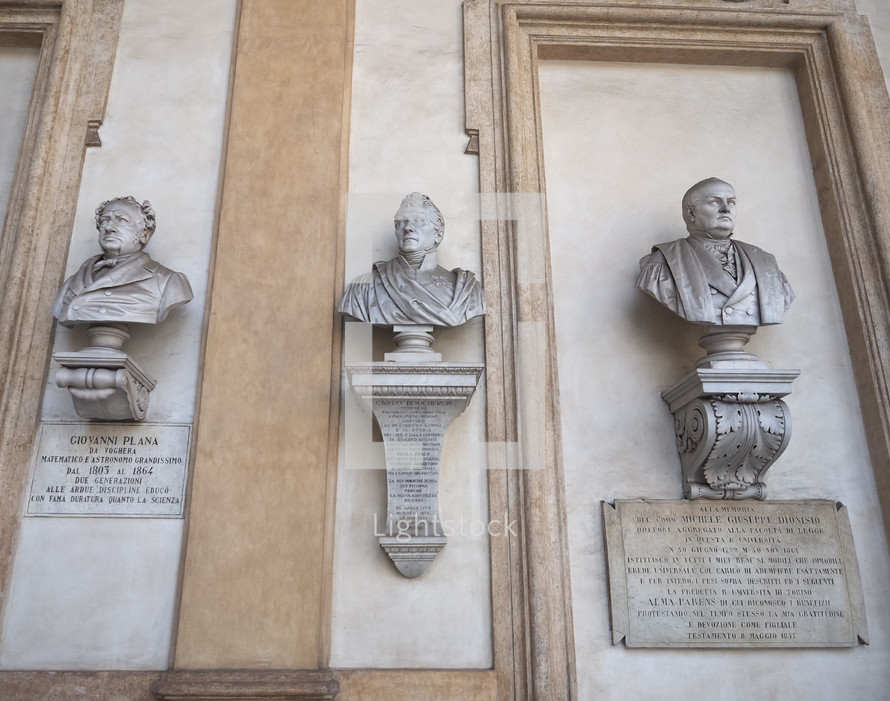TURIN, ITALY - CIRCA AUGUST 2021: Statues of Carlo Boucheron, Giovanni Plana and Michele Giuseppe Dionisio at Turin University circa XIX century by unknown artist
