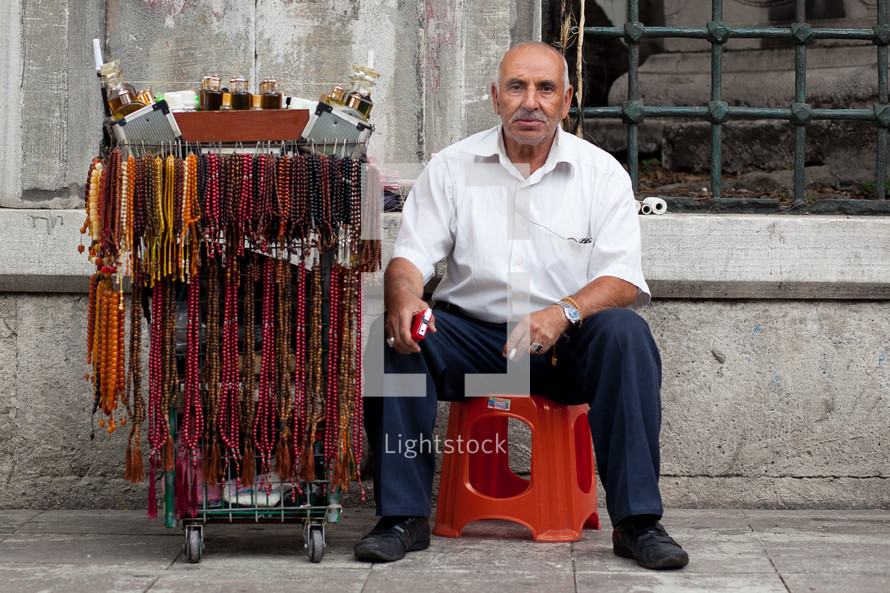 Muslim Turk street vendor selling Islamic prayer beads