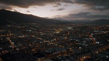 Elevated twilight aerial over the populous capital city of Quito, Ecuador	