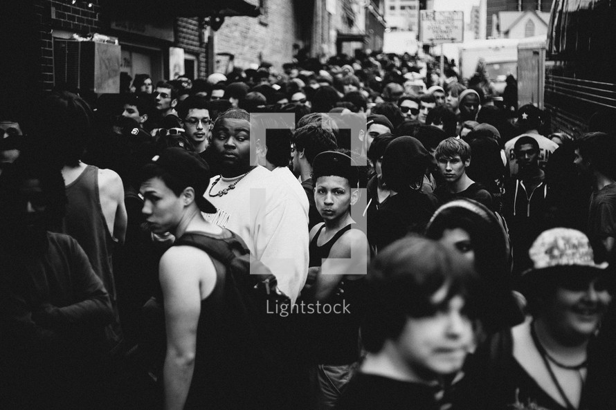 crowds of people on a busy sidewalk