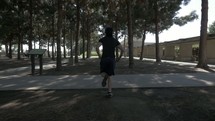 man running in a park 
