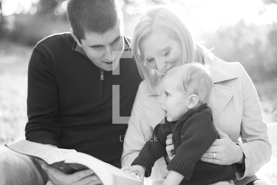A young family reading the Bible together