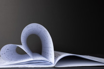 sheet music folded into the shape of a heart 