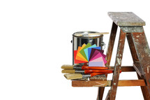 ladder, paint can, paint brushes, and paint swatches 