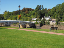 Old Wye Bridge crossing the river between Monmouthshire in Wales and Gloucestershire in England in Chepstow, UK