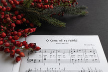 Christmas sheet music on a black background 