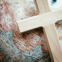 cross on a globe over Russia and Ukraine 