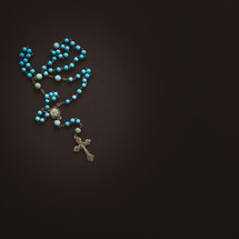 rosary on a black background 