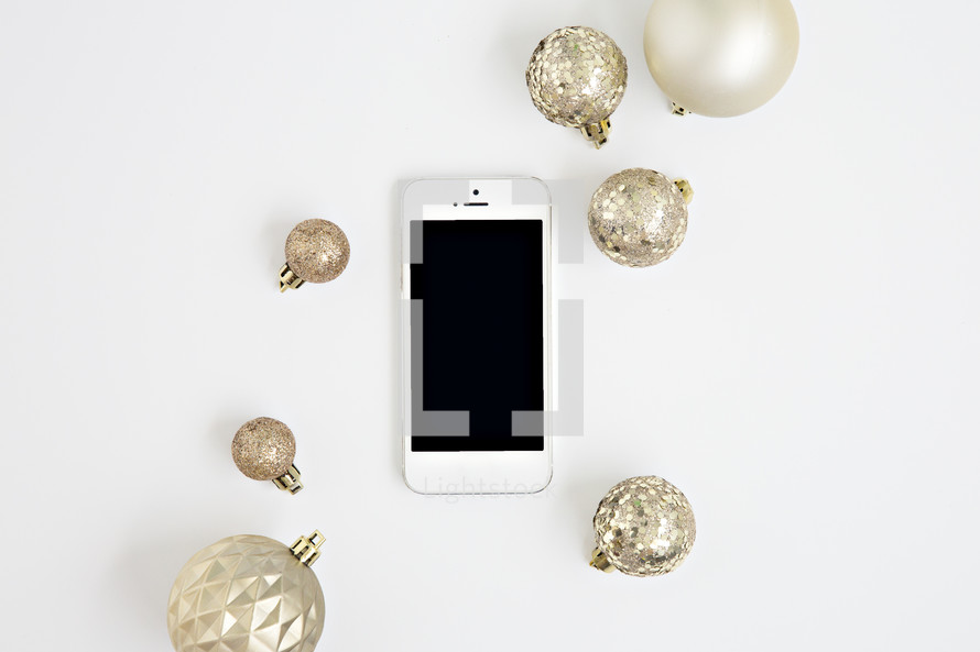 iphone and gold Christmas ornaments 