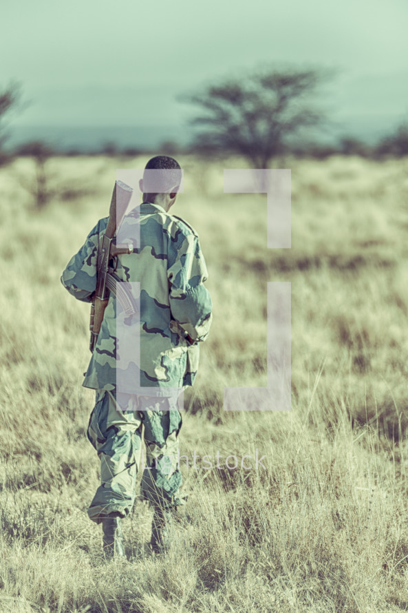 soldier with a gun in Africa 