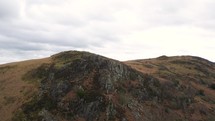 Hill with rock face, Jib down