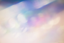 cream, blue, turquoise, purple, pink and peach colored bokeh lighting - abstract background