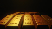 Gold bars are densely arranged on a black background
