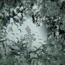 snowflake and ice closeup on a window