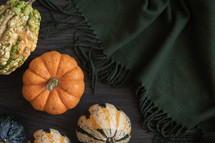 Gourds on a green blanket 