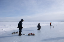 Family curling on a lake